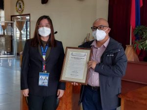 Governor Dr. Melchor Daguines Diclas receives a Certificate of Recognition from the Overseas Workers Welfare Administration (OWWA)